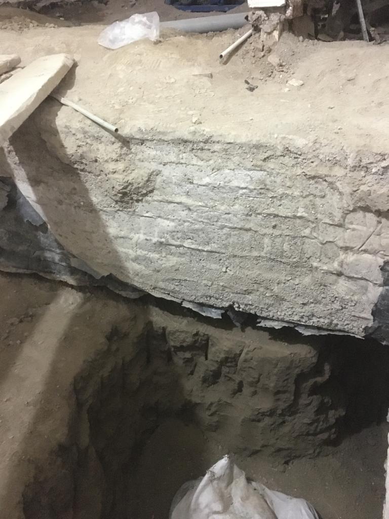 اصلاح نشست و شاقول سازی ساختمان مسکونی بتن آرمه 7 طبقه به وزن 2700 تن با نشست نامتقارن 30 سانتیمتر